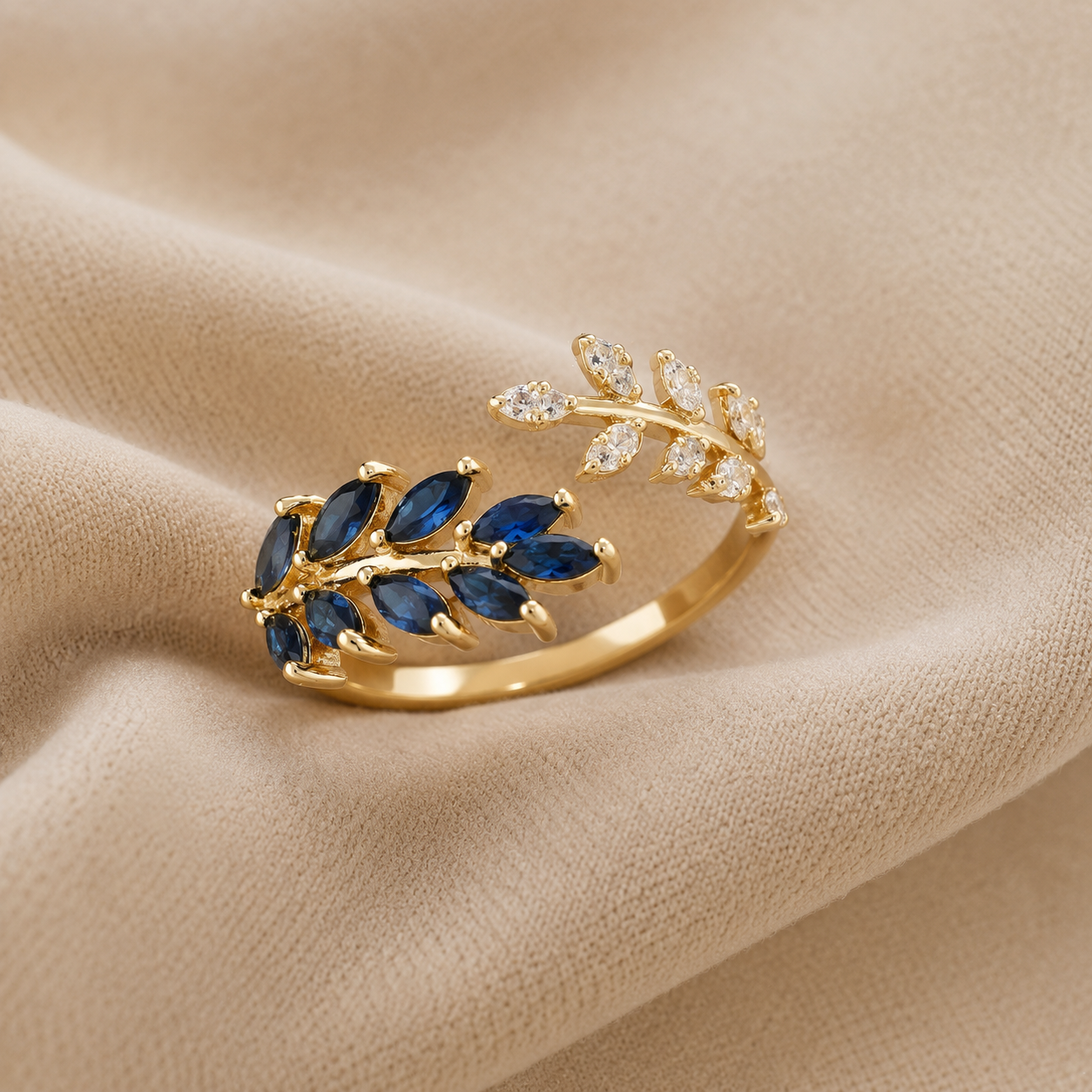 BAGUE FEUILLE DORÉE AU SAPHIR